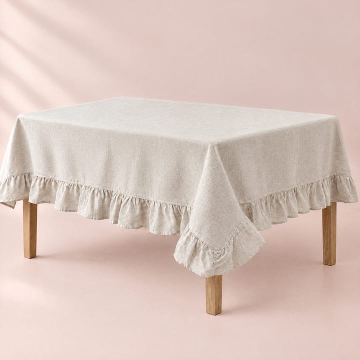 Ruffled edge falling in soft waves around the table