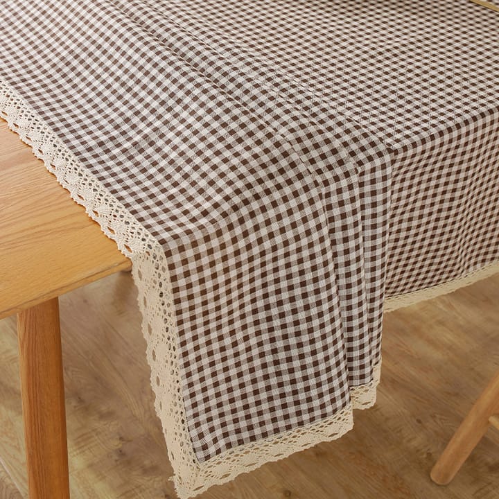 Close-up of the brown check and cream lace edge