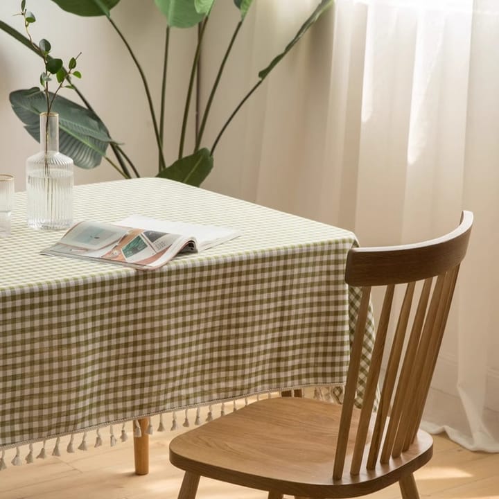 Green gingham tablecloth on a wooden table