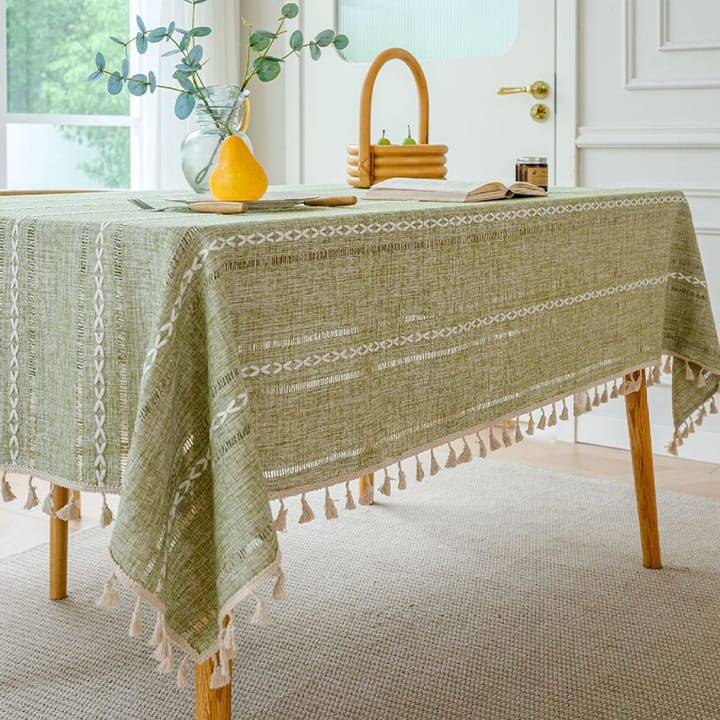 Sage woven tablecloth by a window