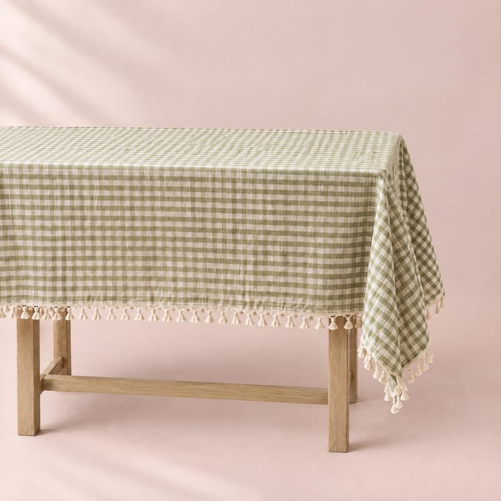 Green gingham tablecloth by a window