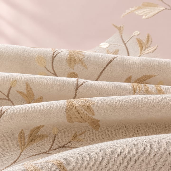 Close-up of the gold embroidered leaves