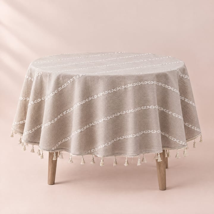 Round tassel tablecloth on a round dining table set for brunch